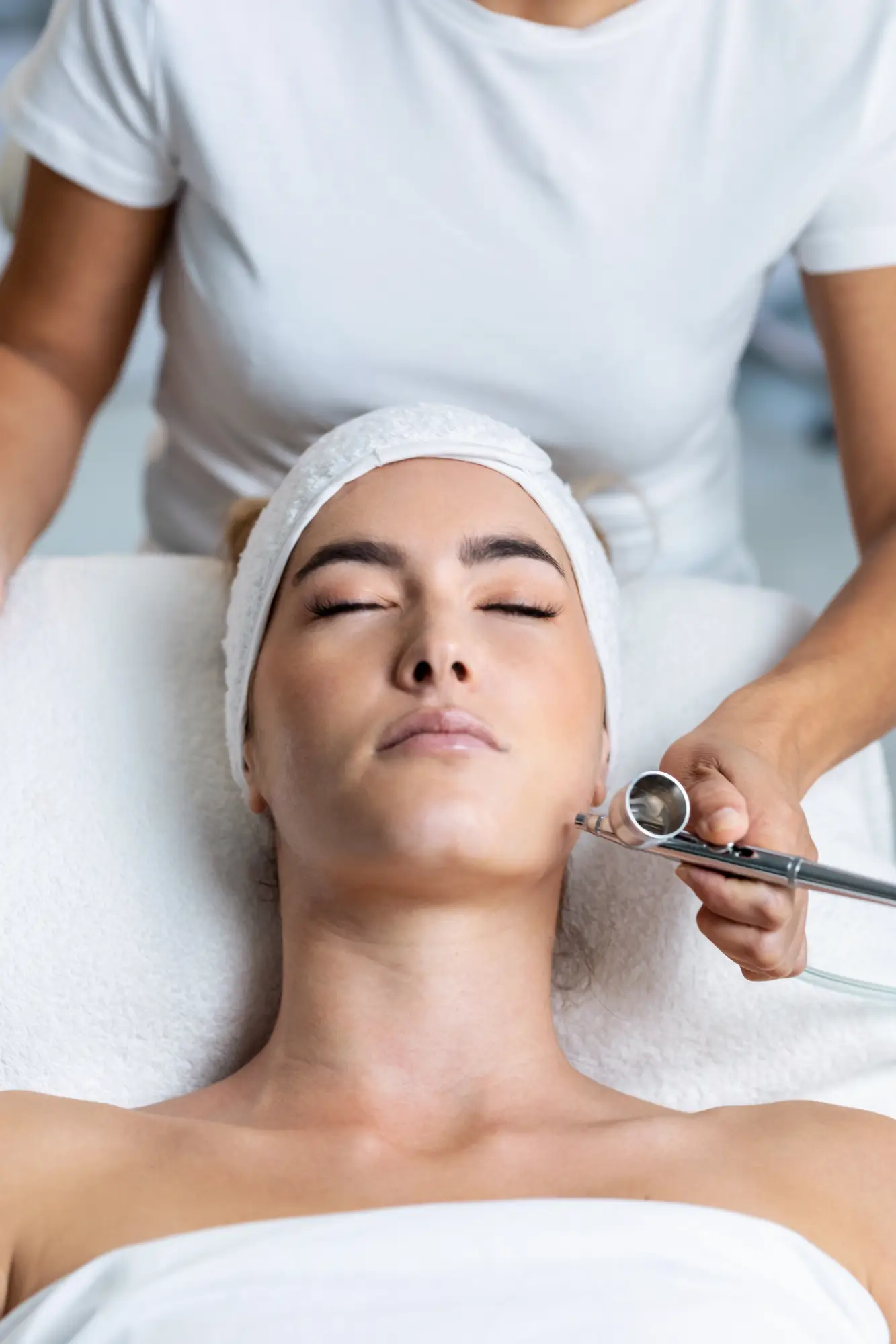 a woman getting a face massage