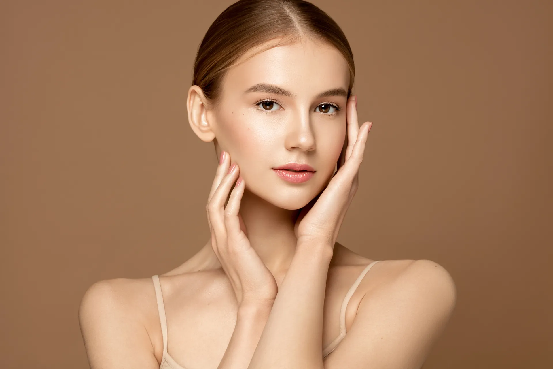a woman with her hands on her face