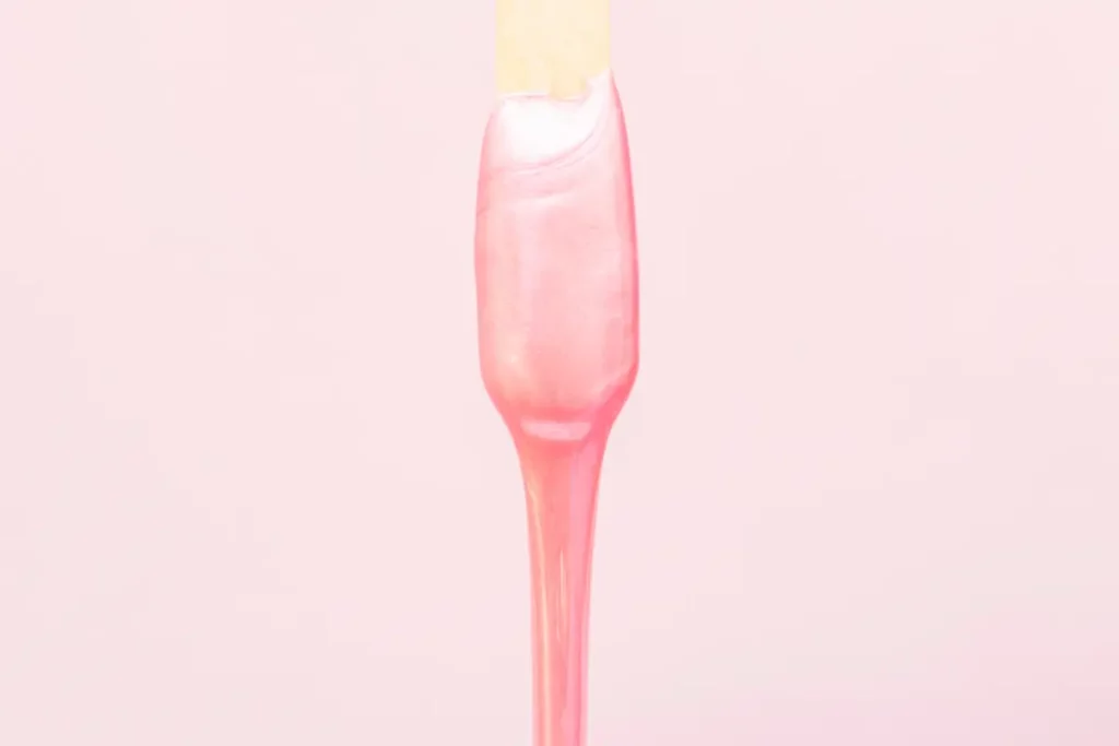 Portfolio a pink liquid on a stick
