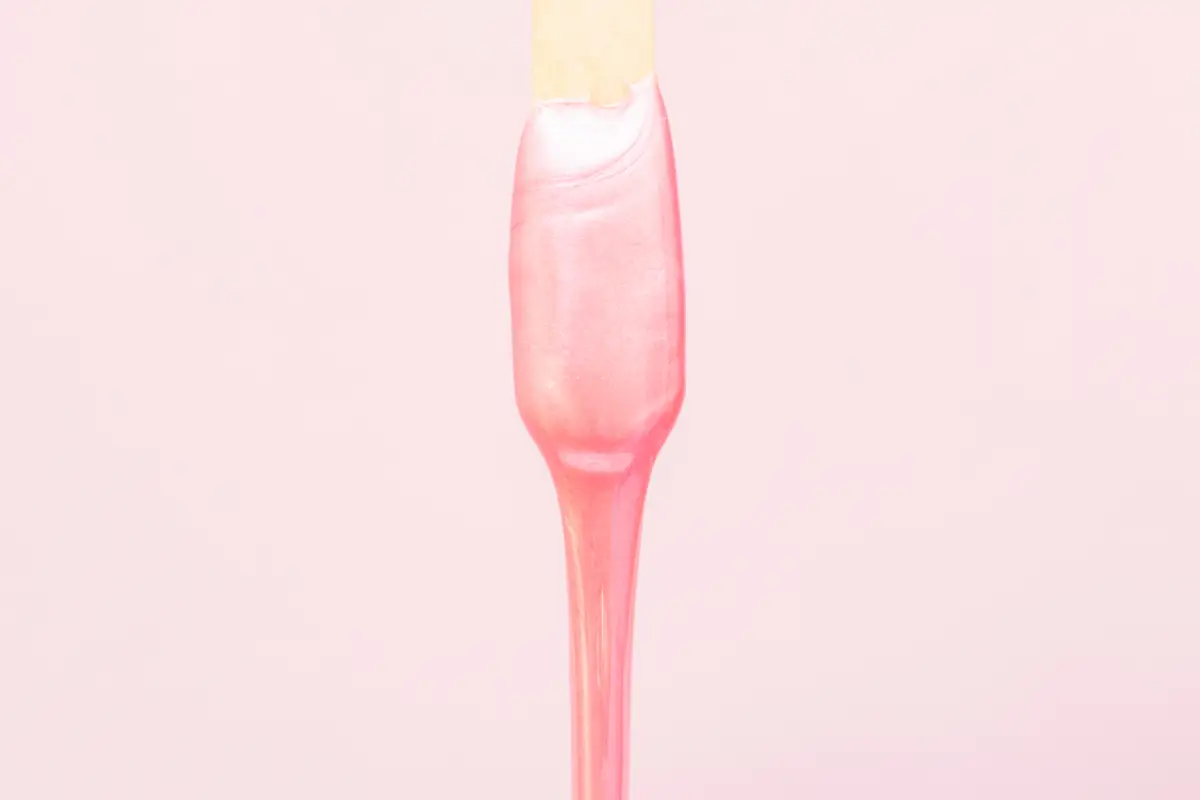 a pink liquid on a stick