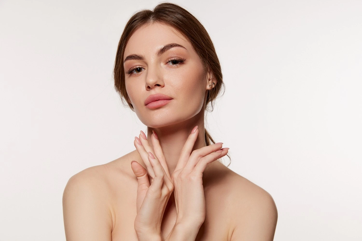a woman with her hands on her face