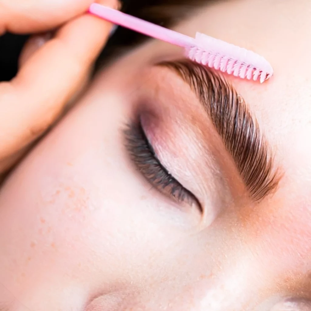 Portfolio a person with a pink brush on their eyebrow
