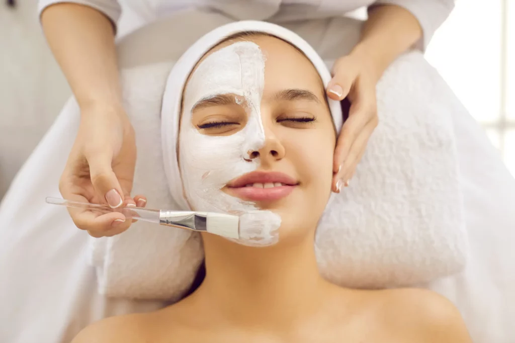 Portfolio a woman getting a facial mask