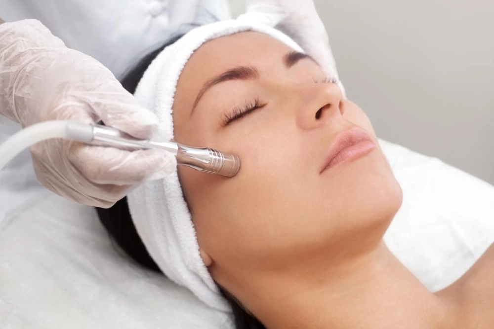 a woman receiving a facial massage