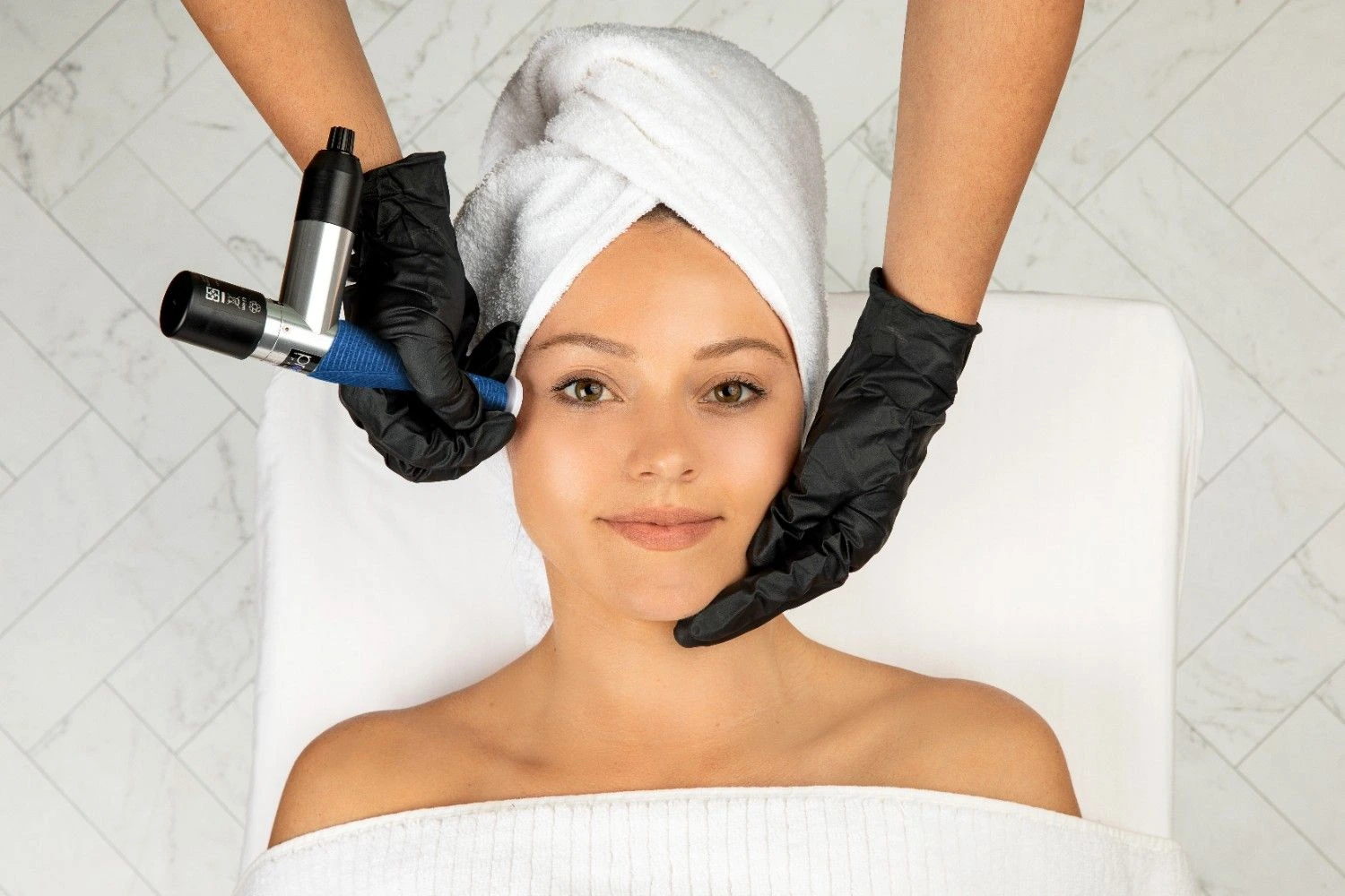 a woman getting a facial massage