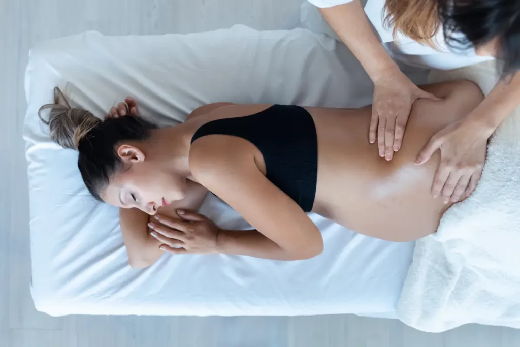 Portfolio a woman lying on a bed with her hands on her stomach