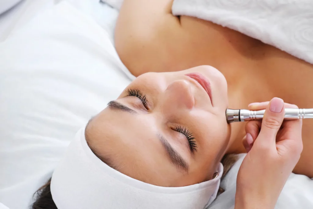 Portfolio a woman lying down with a tool on her face